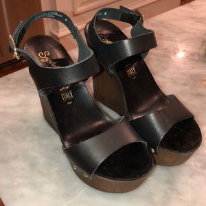 Black leather and dark wooden wedges